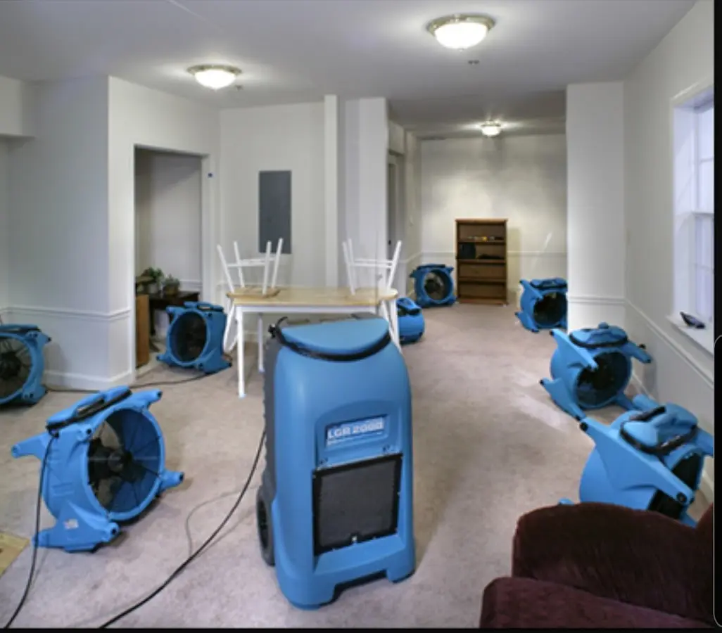 Air movers and dehumidifier setup for Water Damage Restoration in Bay City